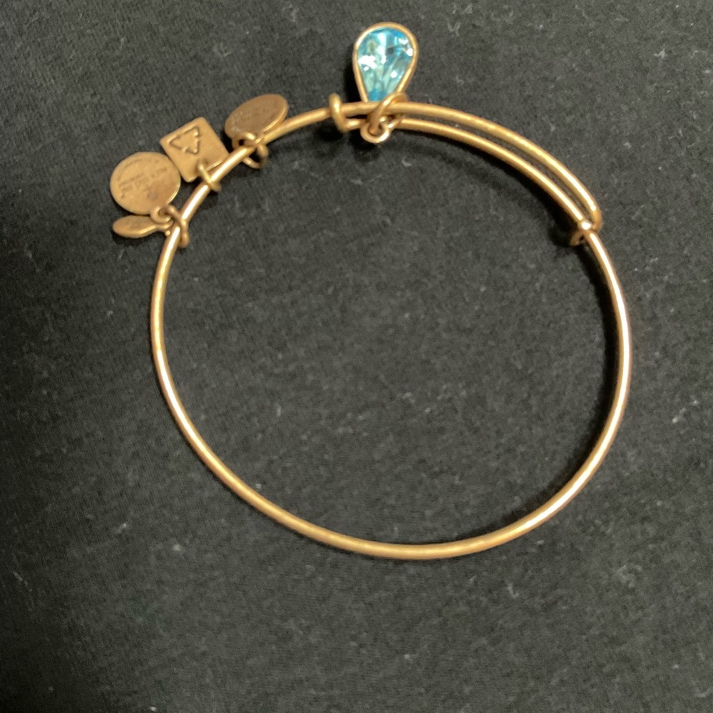 Gold Bangle Bracelet with Blue Charm
